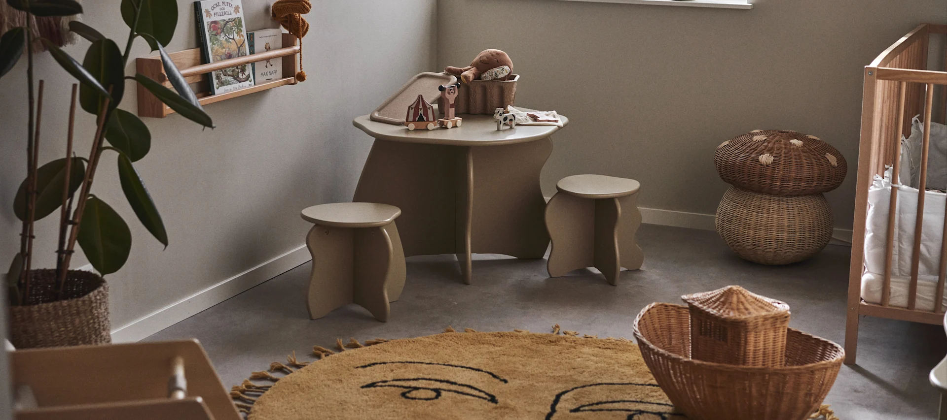 Tips and ideas for your childs room. Here you see the Slope table and stools in a neutral coloured children's room with wicker details. 