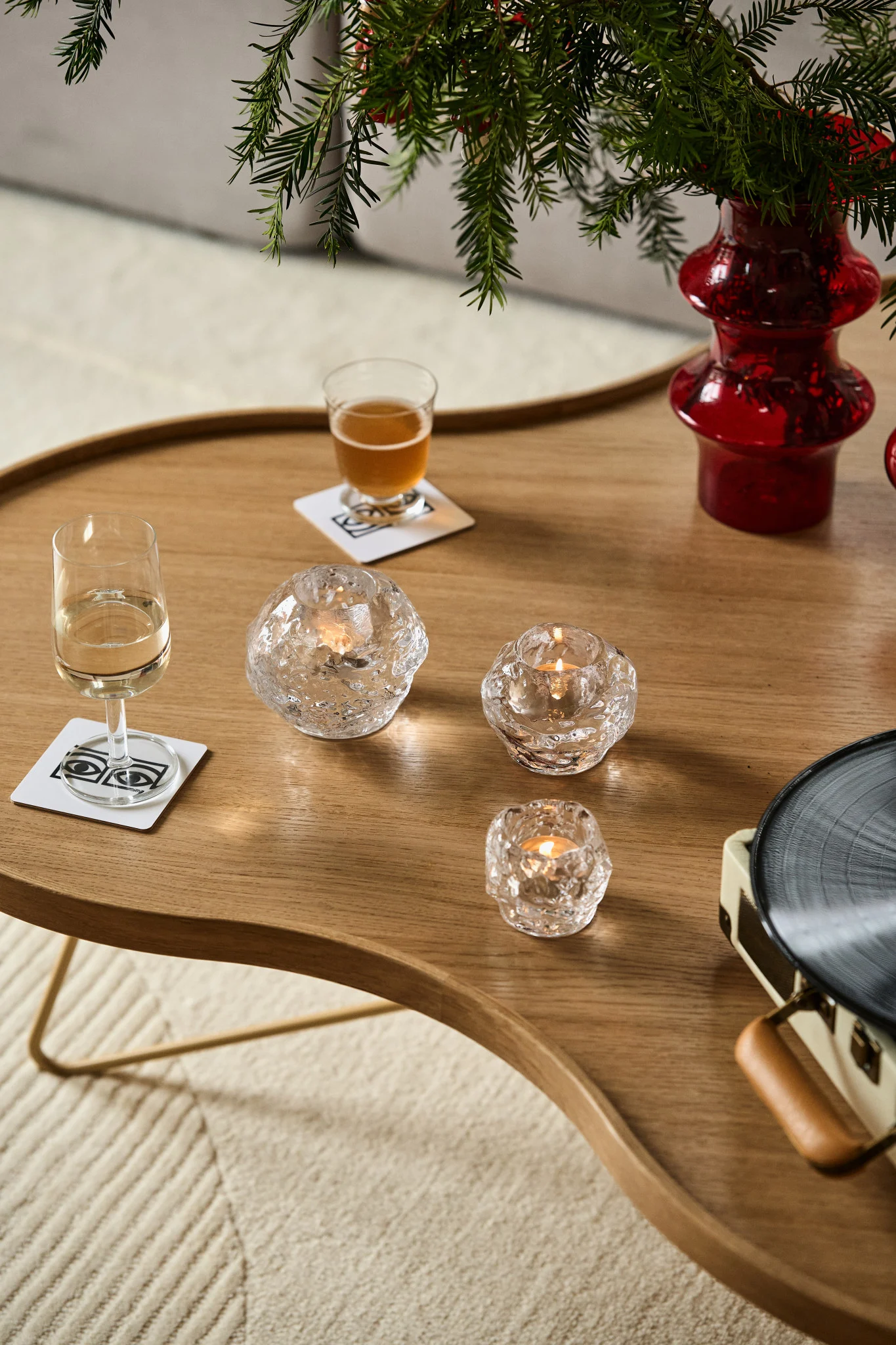 The Snowball candle holder comes in three different sizes and sits on a Swedese table.
