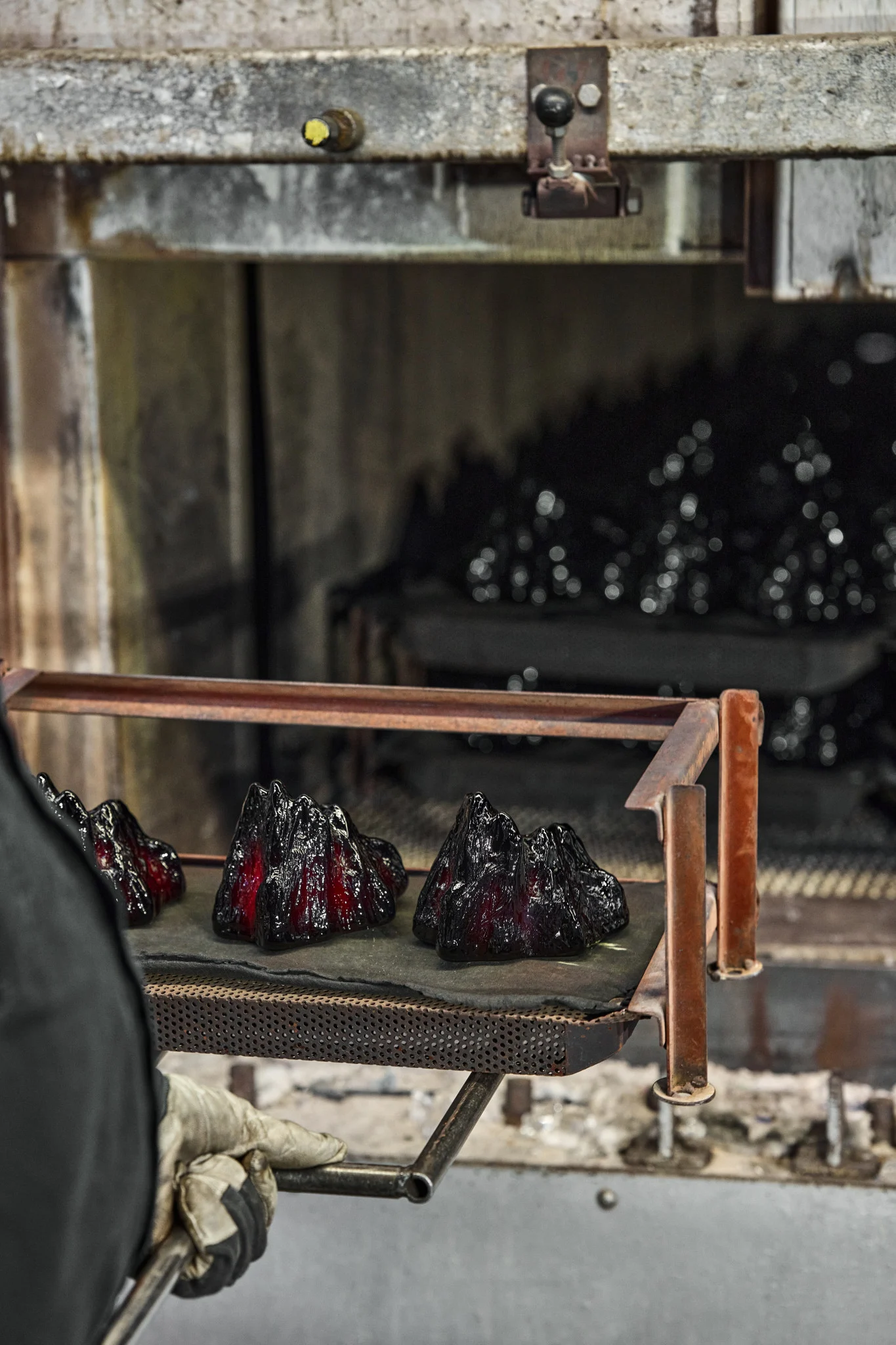 The hardened The Rock candle holders stand on a tray.