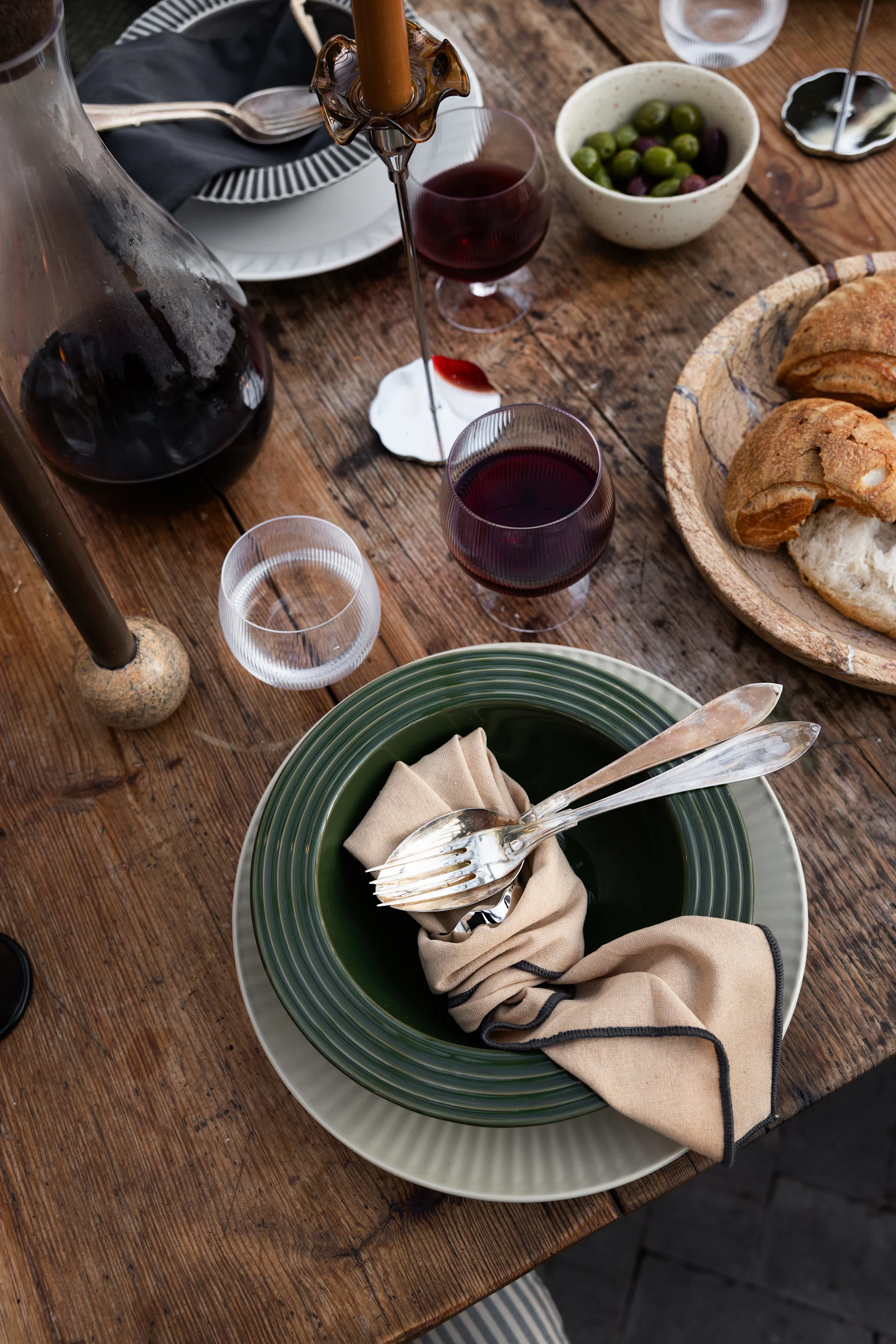 A table set with water, wine and various plates from Sagaform's Coffee & more collection.