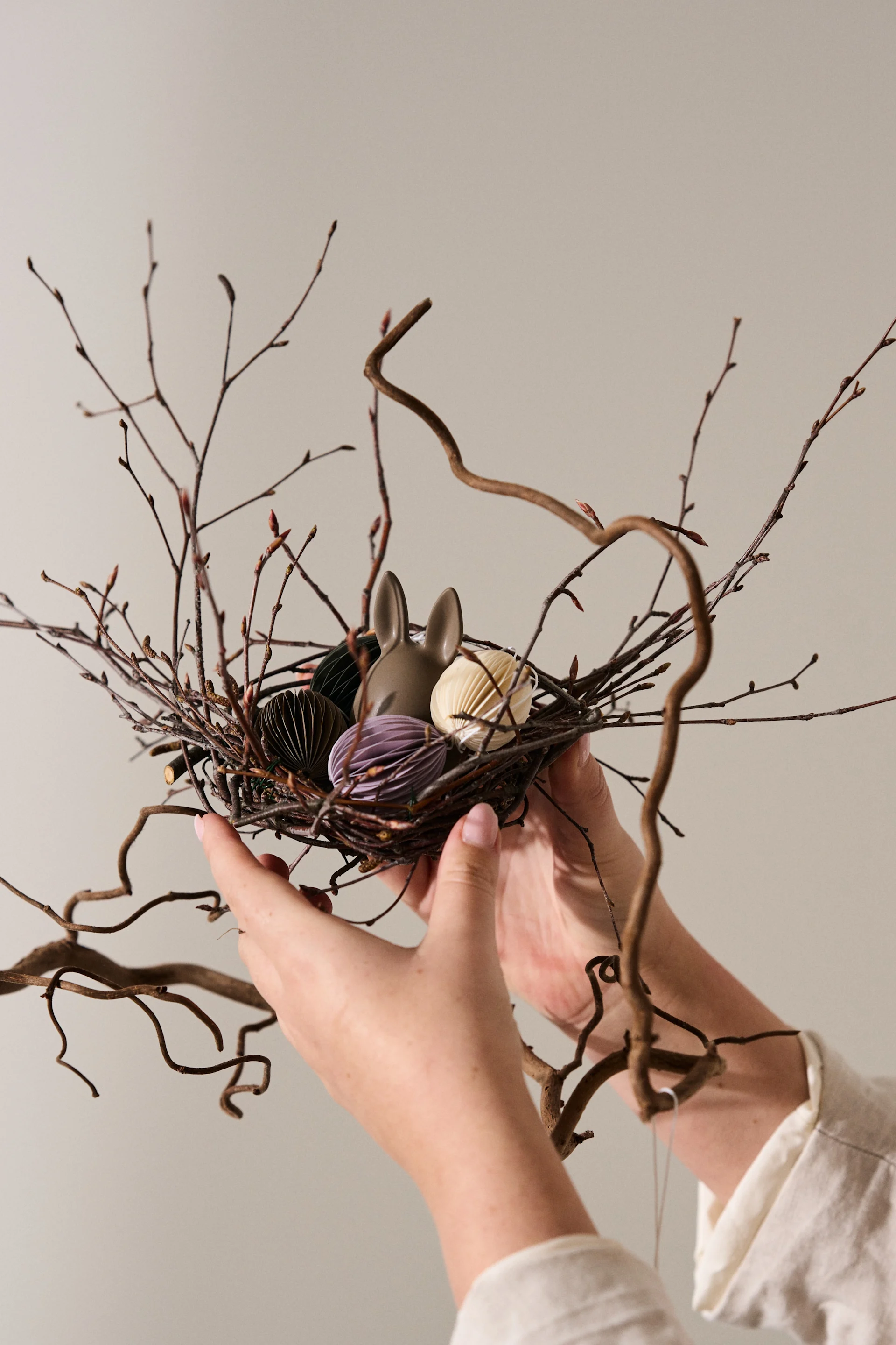 Create an Easter tree with a miniature birds nest in the branches.