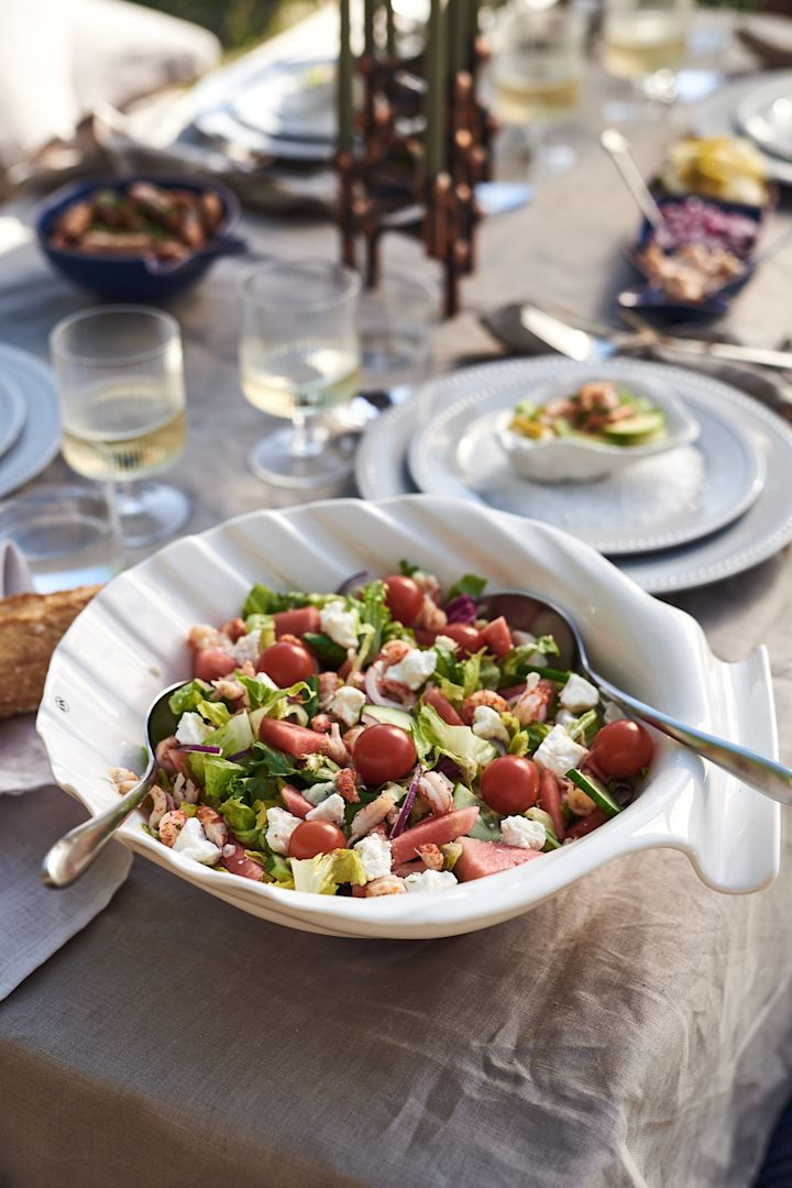 Simple summer recipes like the salad you see here with watermelon and crayfish in a shell shaped bowl. 
