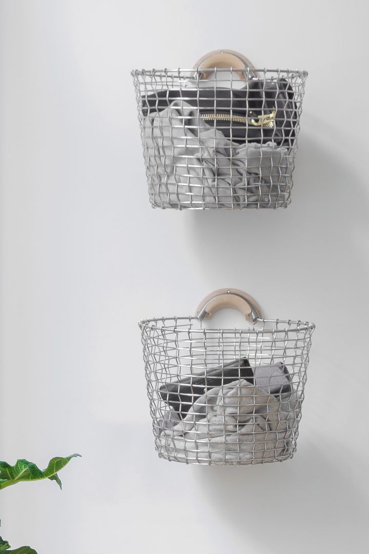 Storage ideas for small bathrooms - hang items on the wall to keep them off the floor, here you see the Korbo basket hanging on the wall as laundry baskets. 